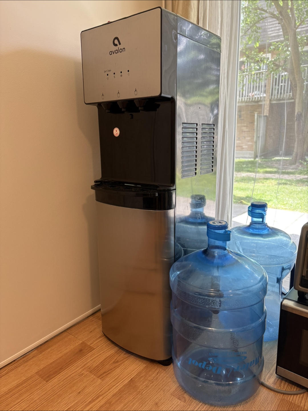 Water Dispenser + Three 5-Gallon Bottles – $100