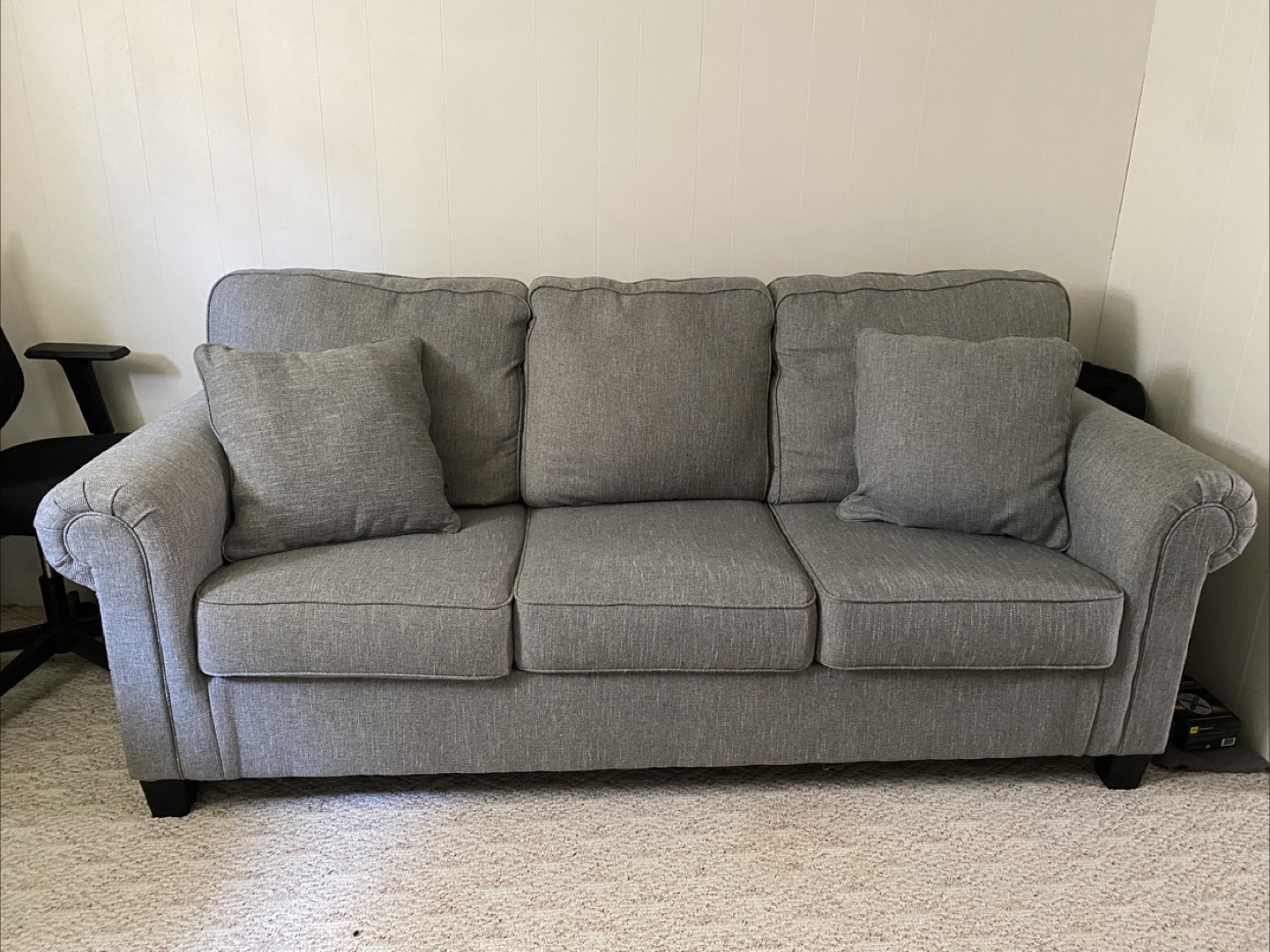 Green Three-Seat Sofa with Pillows