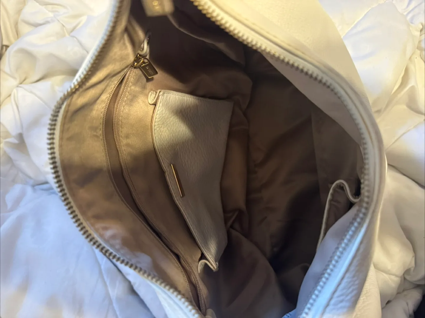white danier leather hobo bag image indicator(2)