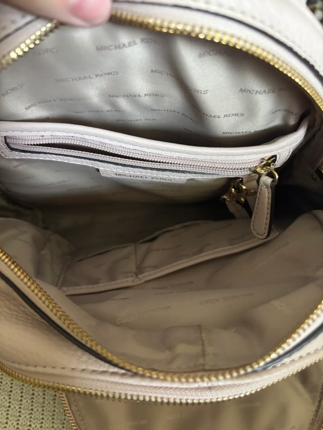 MK Rhea Medium Pebbled Leather Soft Pink Backpack image indicator(10)