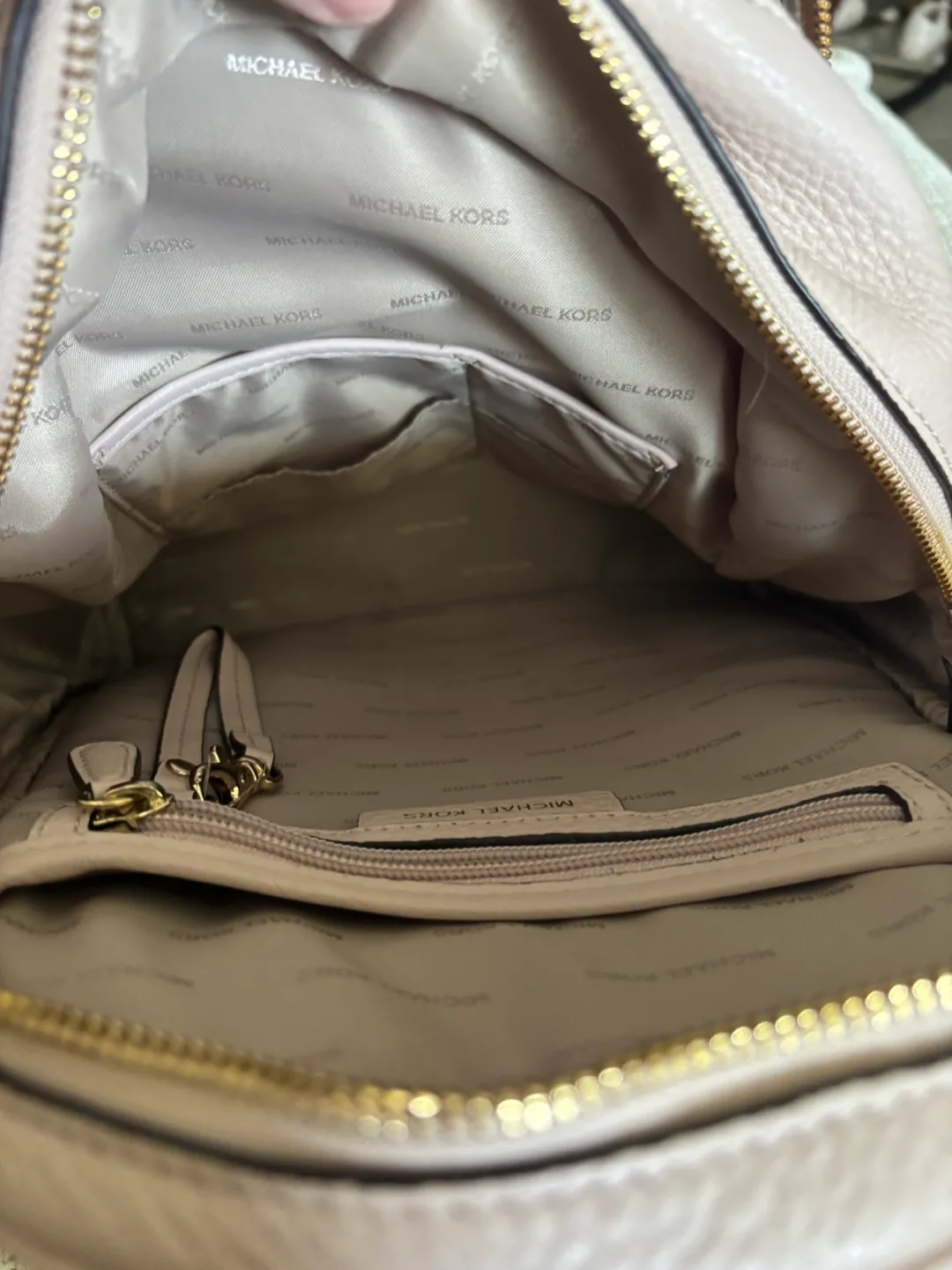 MK Rhea Medium Pebbled Leather Soft Pink Backpack image indicator(8)