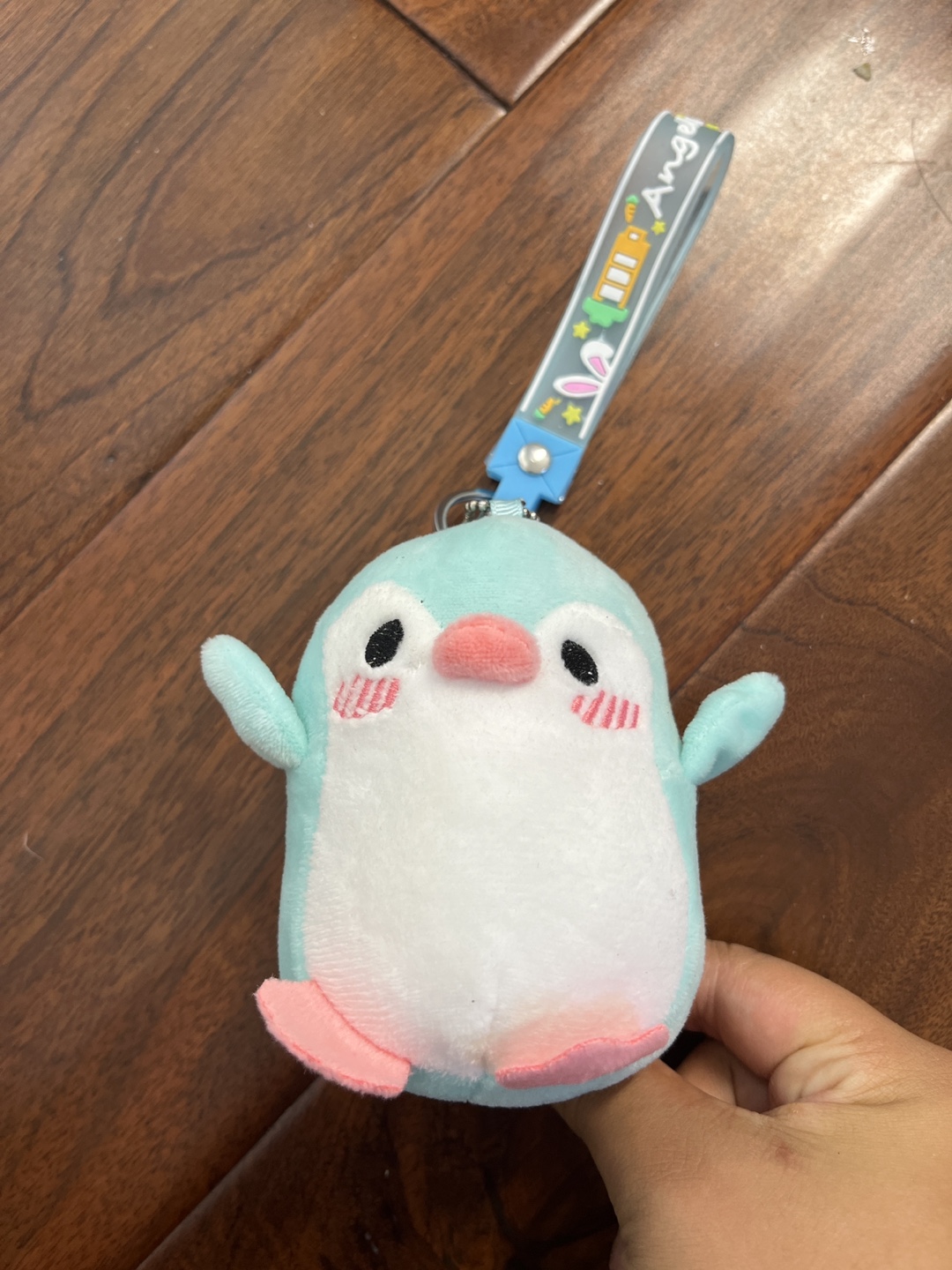 Little blue penguin with a keychain