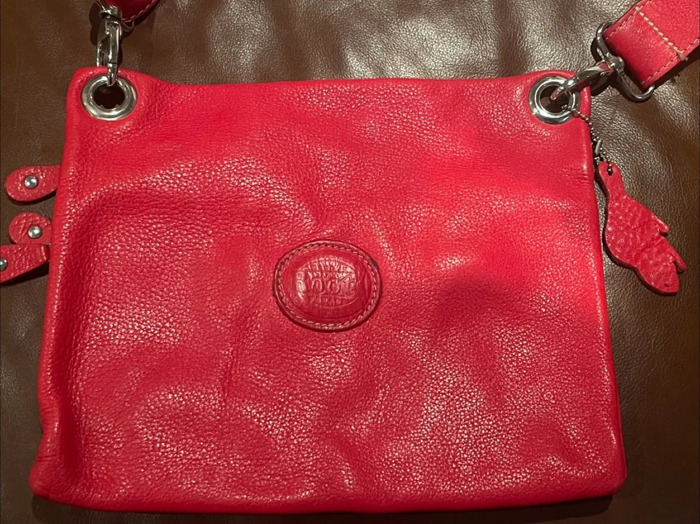 Roots Village Tribe cross body bag in red color image indicator(3)