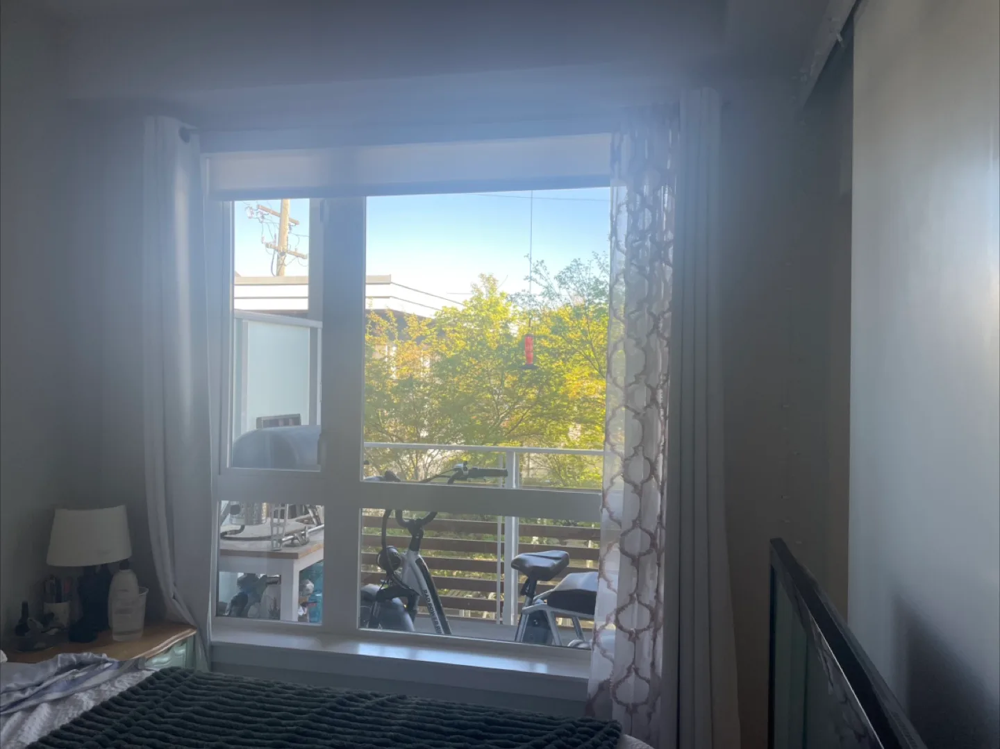 Silver extendable curtain rod with grey curtains thumbnail