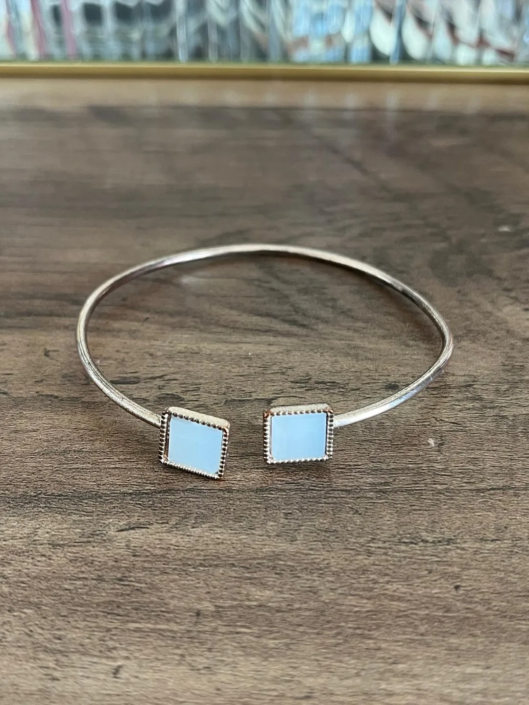 Gold Tone Bangle Bracelet with Light Blue Stone thumbnail
