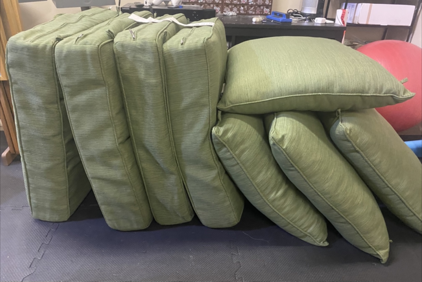 Used green outdoor cushions