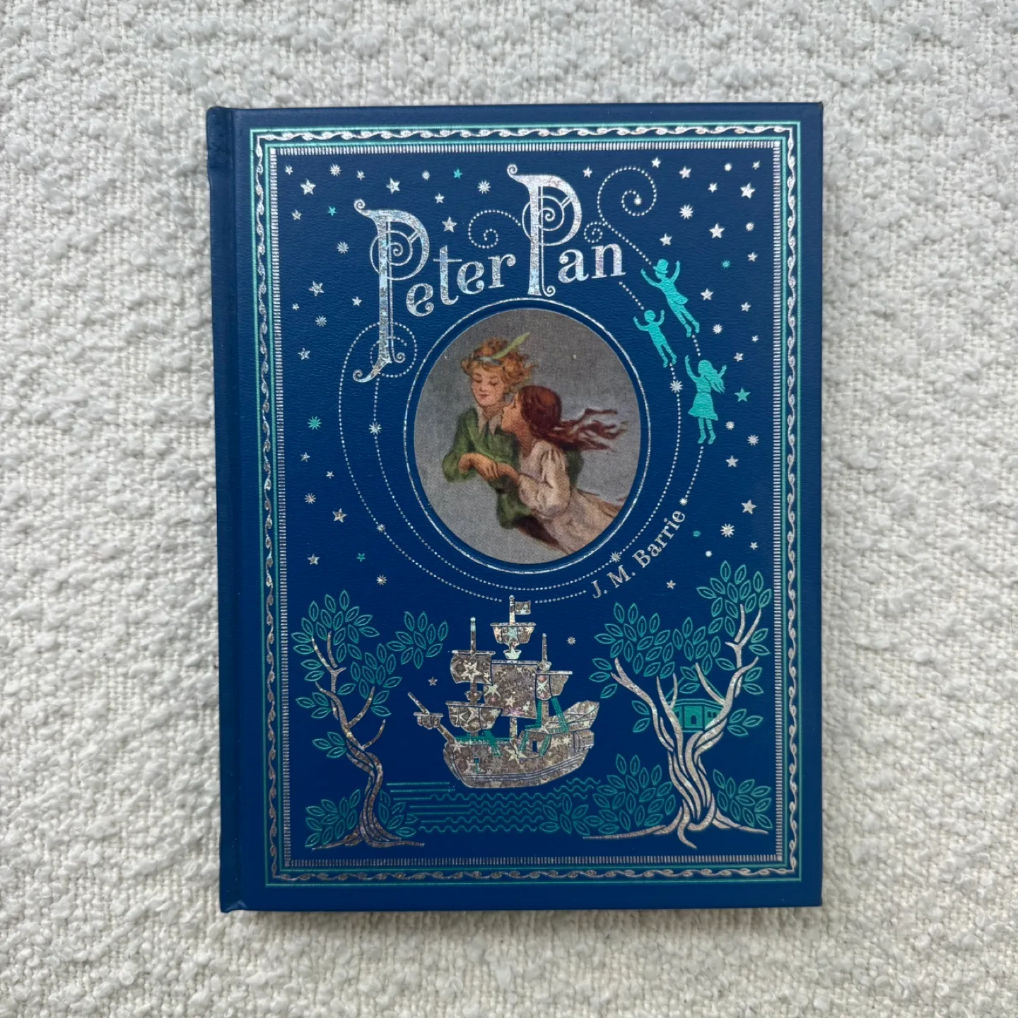 Peter Pan leather hardcover book thumbnail