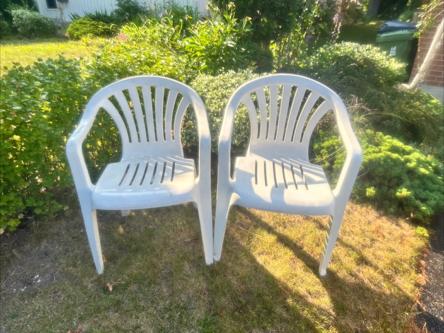 Two White Plastic Outdoor Chairs thumbnail