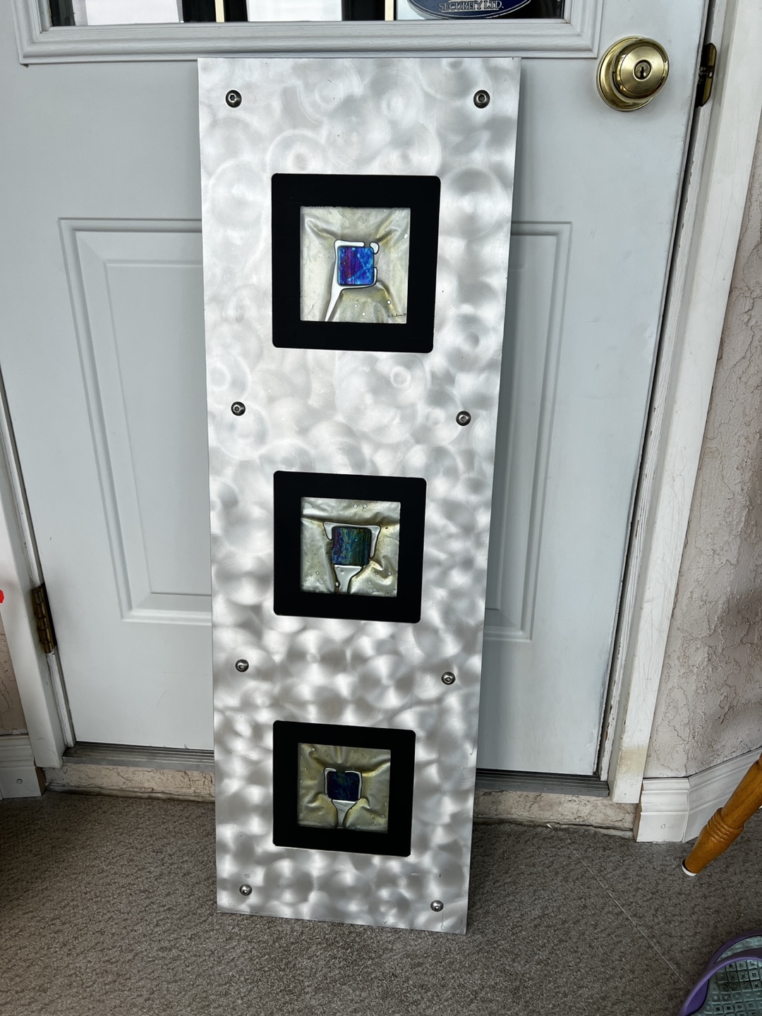 Metal and fused glass artwork.