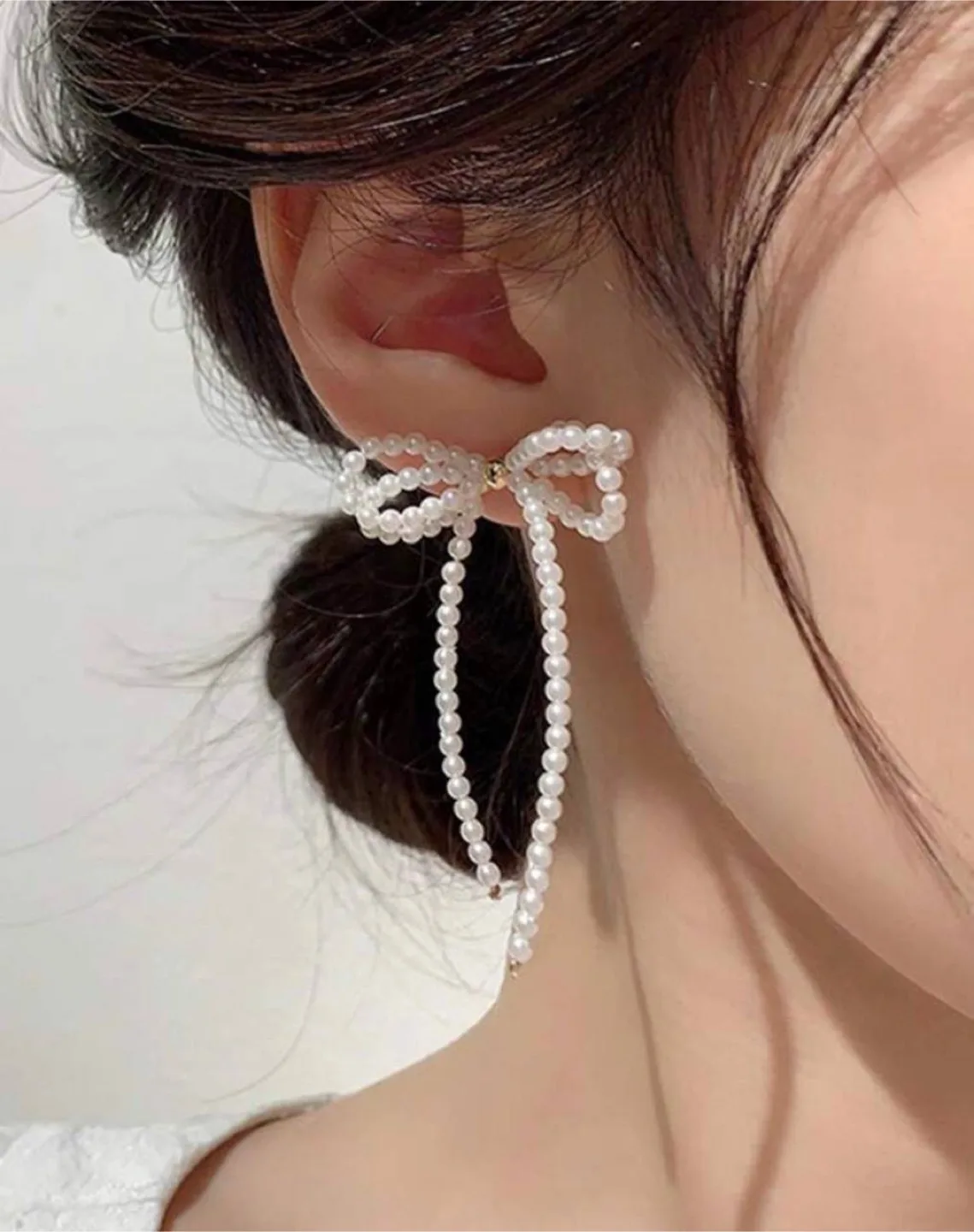 Bow & faux pearl earrings thumbnail