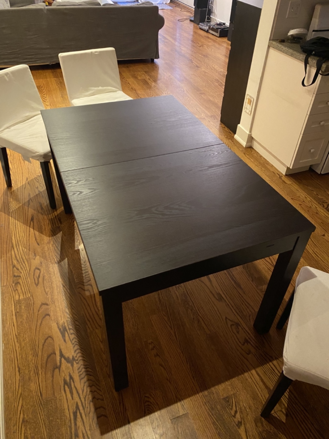 Black IKEA dinner table with chairs
