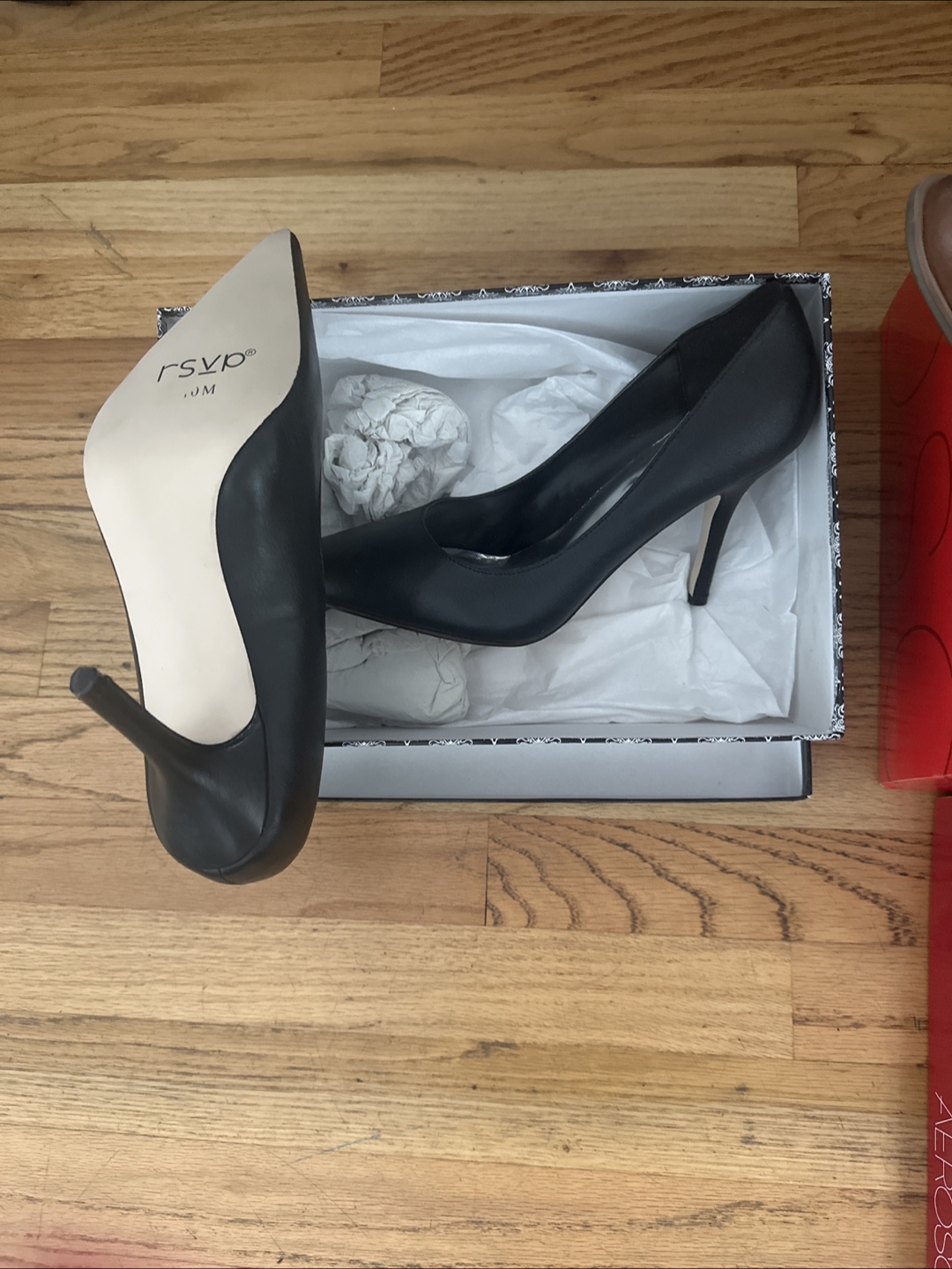 Brand new women’s black heels and brown boots.
