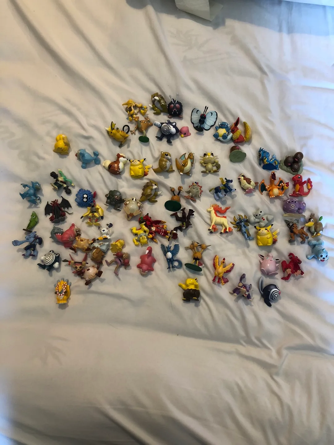 A bag of Pokémon and Digimon toys thumbnail