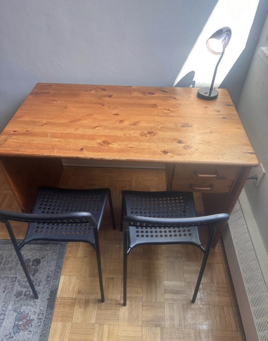 Wooden Desk with Two Black Chairs