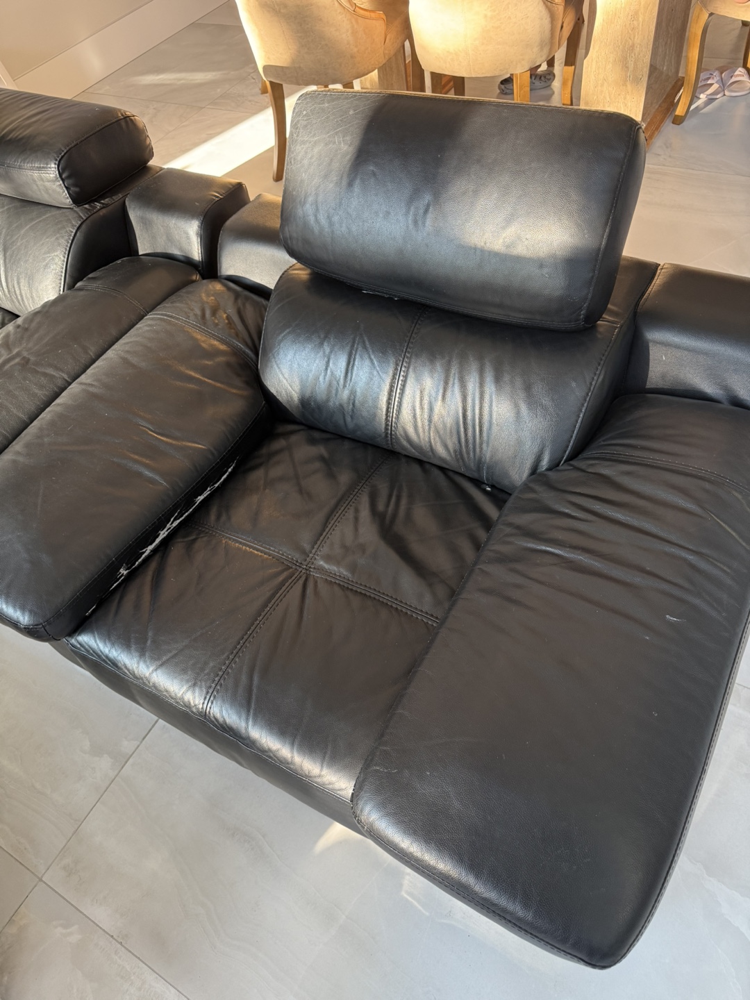 2 black leather chairs