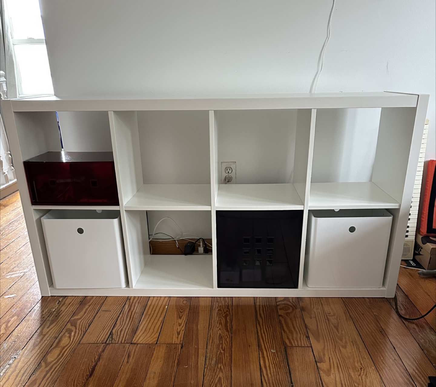IKEA Kallax with 4 storage boxes.