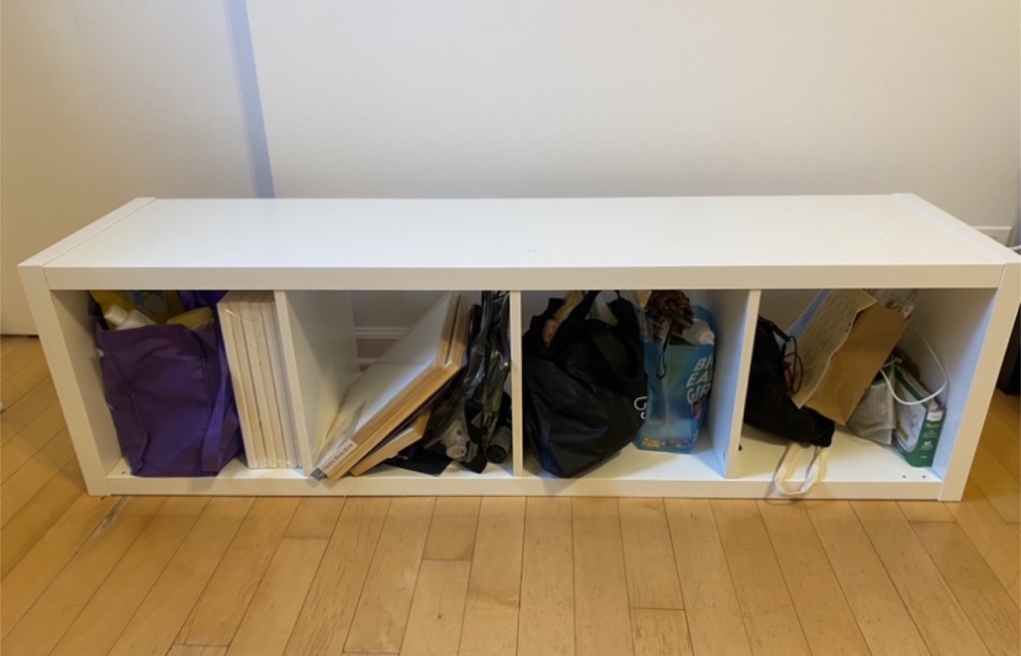 White shelving with four slots