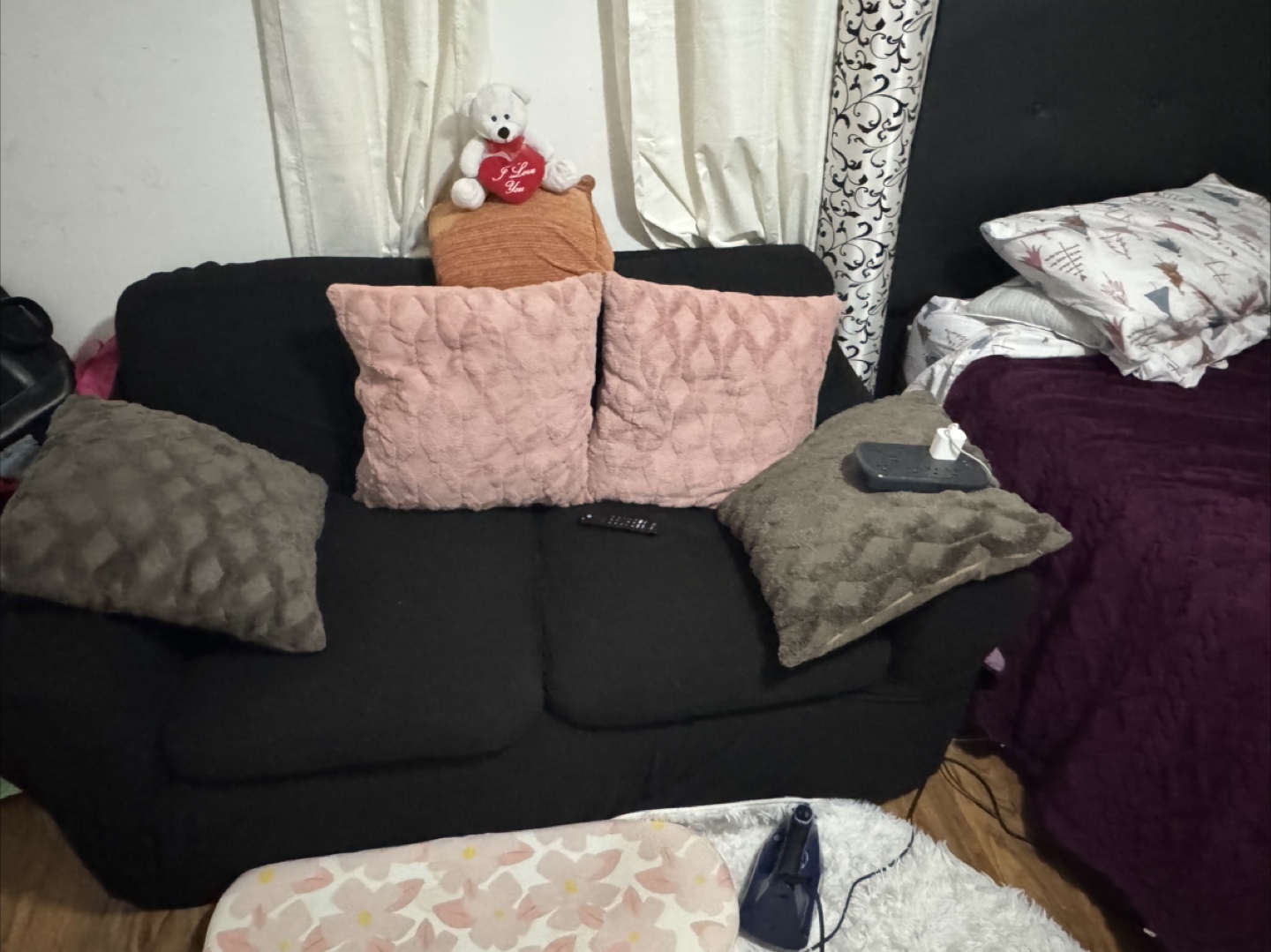 Black Two-Seater Couch with Cushions