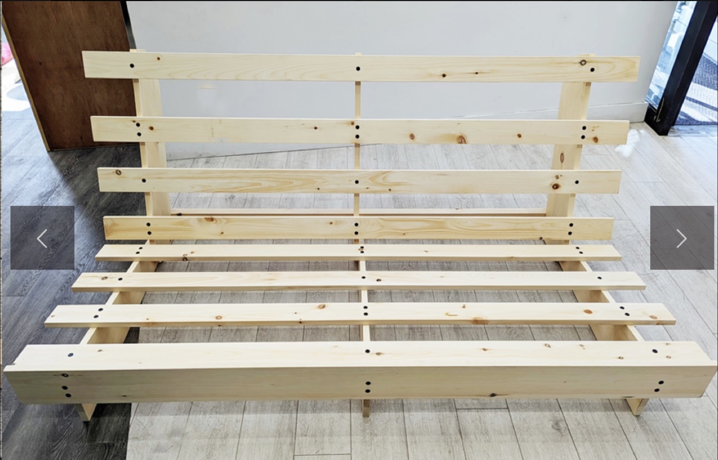 Futon with wooden frame and cushions