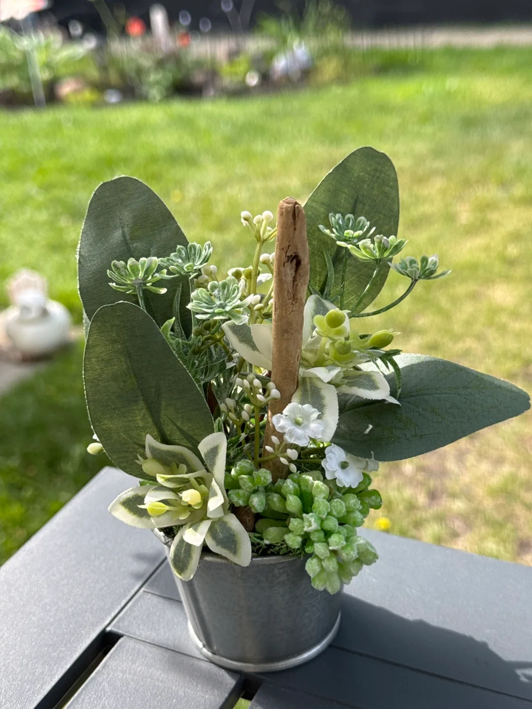 Cute faux floral arrangement in metal pot thumbnail