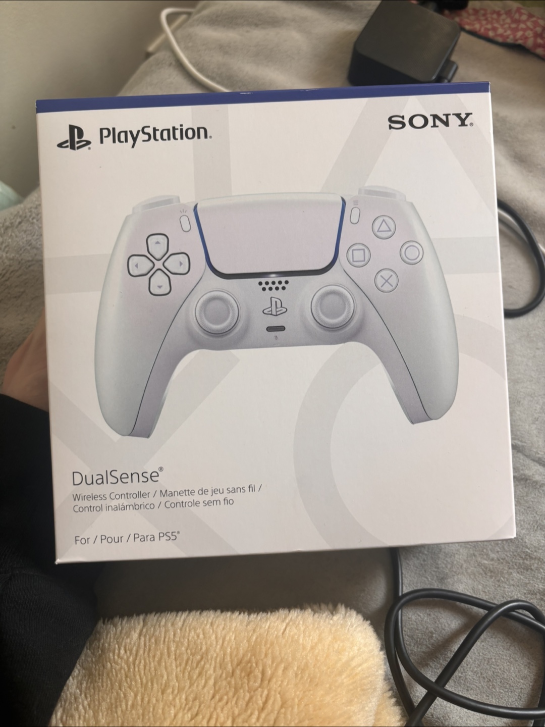 2 white ps5 controllers