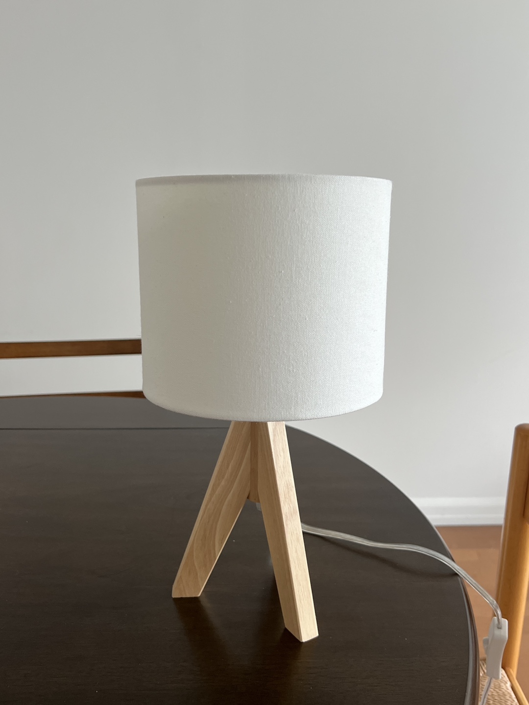 Two wooden tripod lamps
