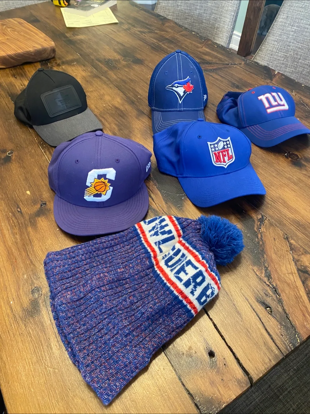 Assorted sports team hats thumbnail