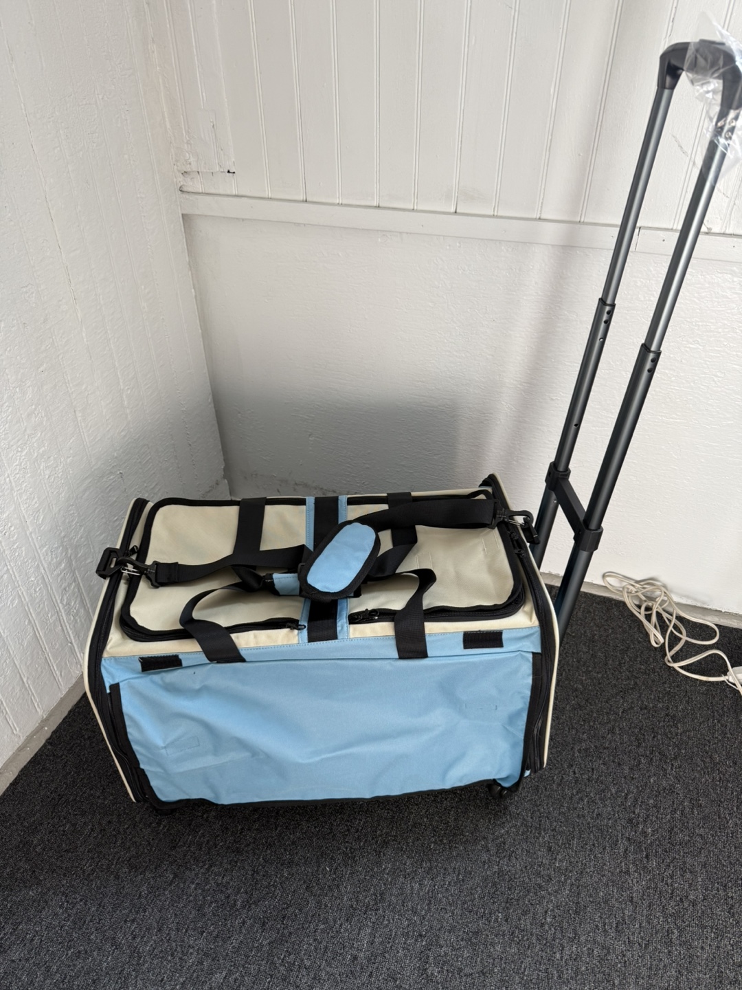 NEW pet carrier w/wheels & handle or strap to carry .