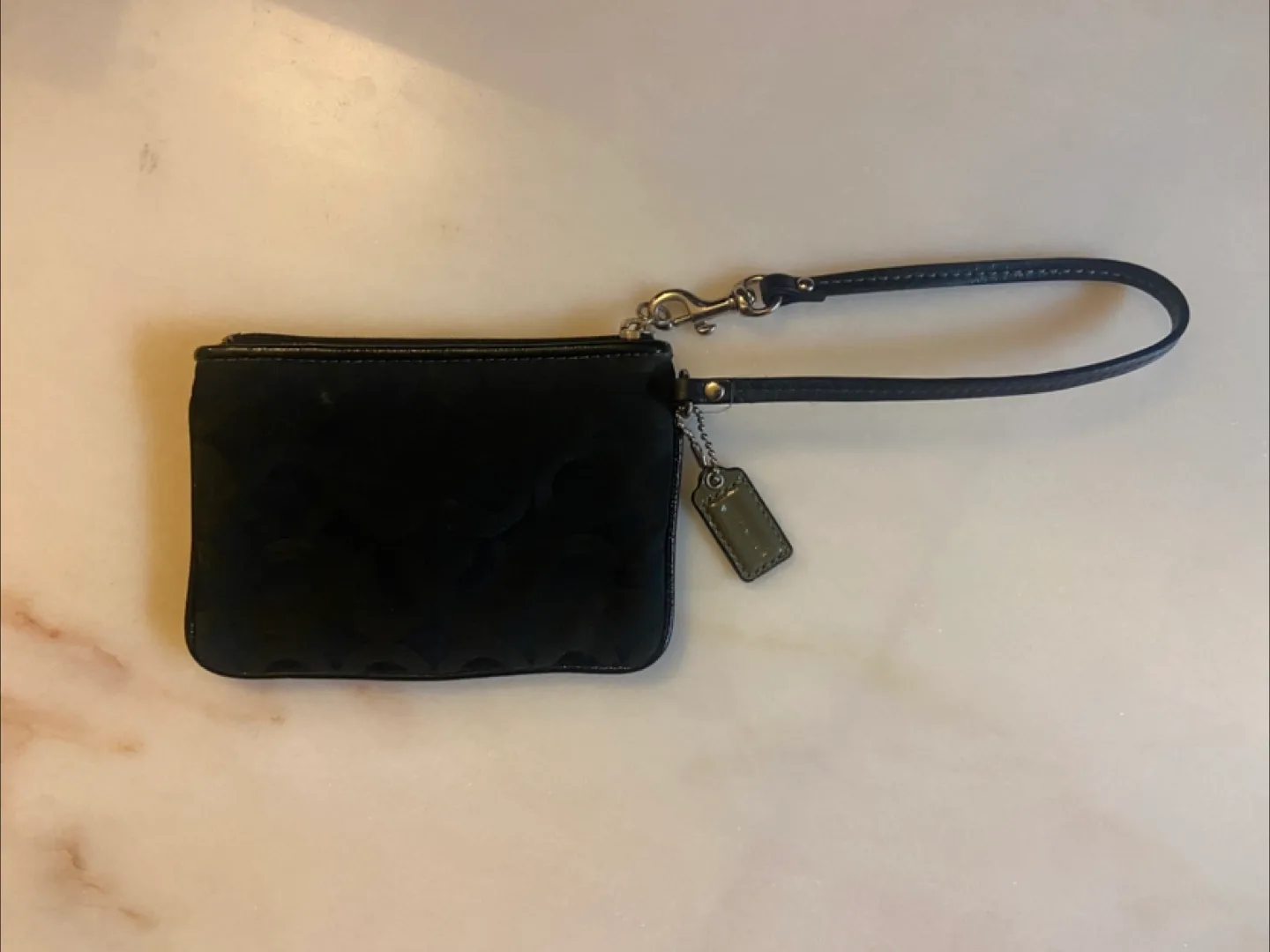 Black COACH wristlet image indicator(2)