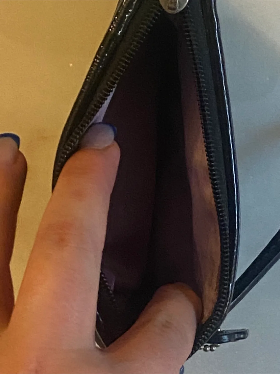 Black COACH wristlet image indicator(3)