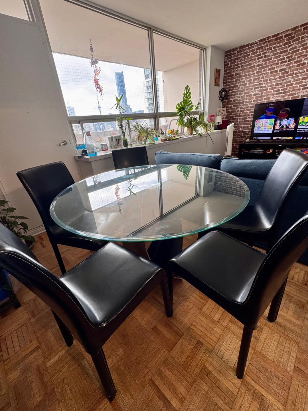 Glass Dining Table with 5 Faux Leather Chairs thumbnail