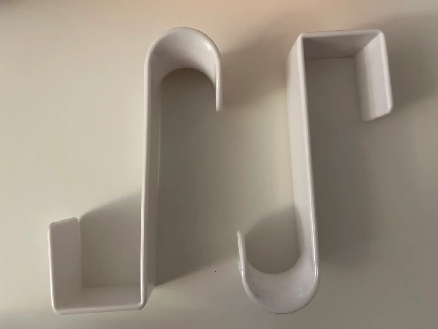 Two White Over-the-Door Hooks thumbnail