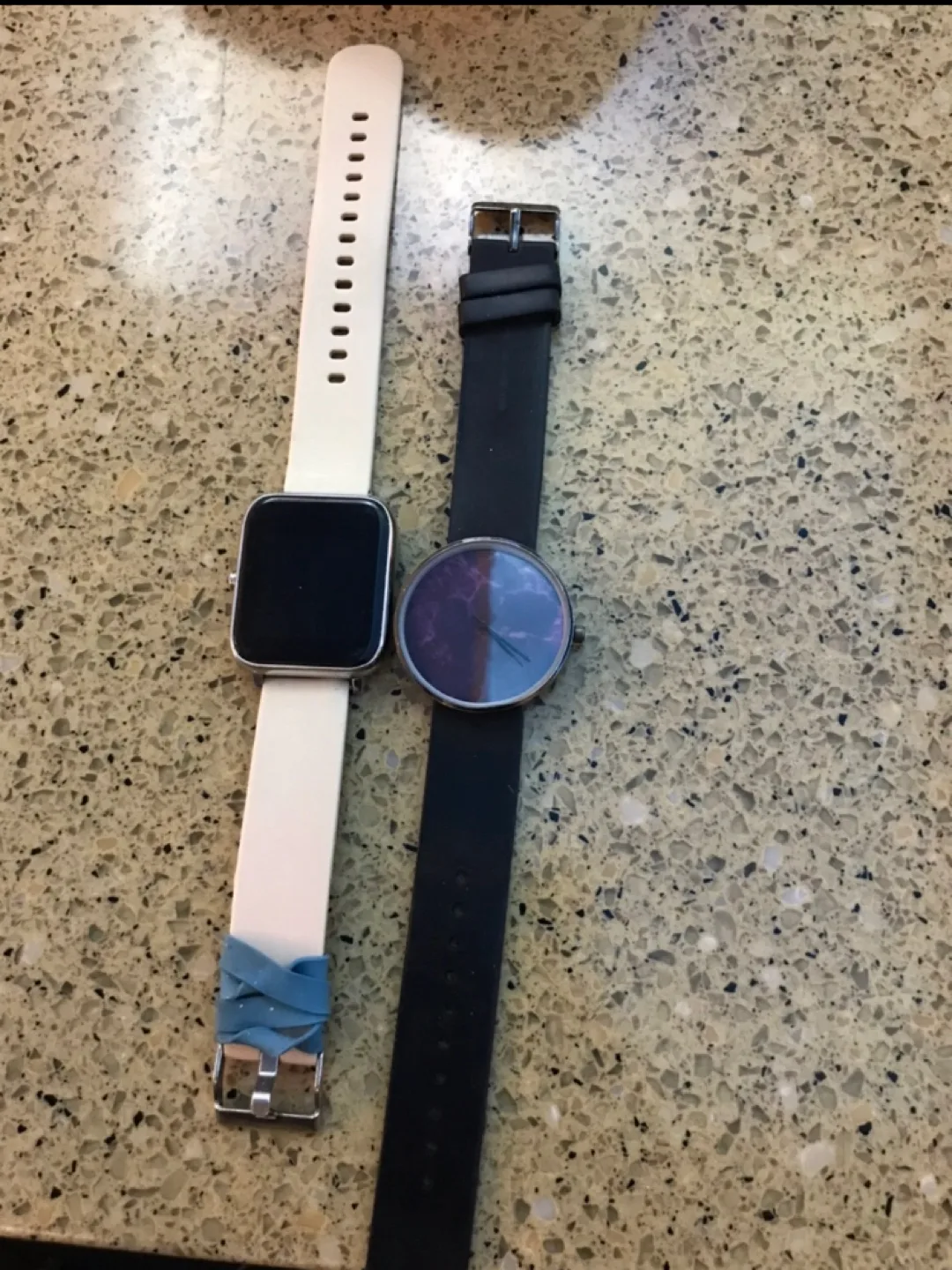 Two watches, one black, one cream thumbnail