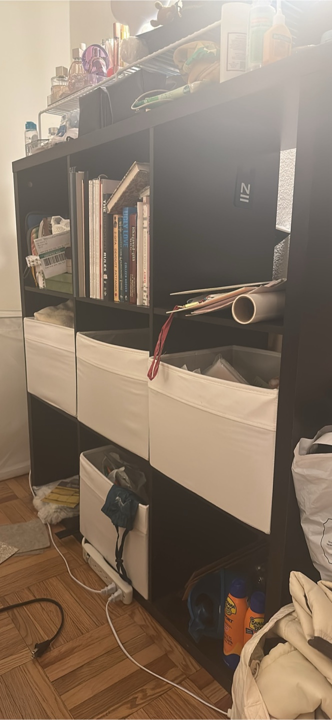 Black Shelf with White Storage Bins