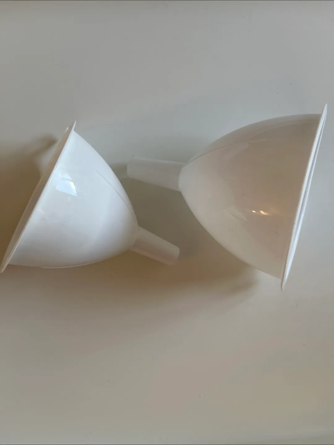 Two White Plastic Funnels thumbnail