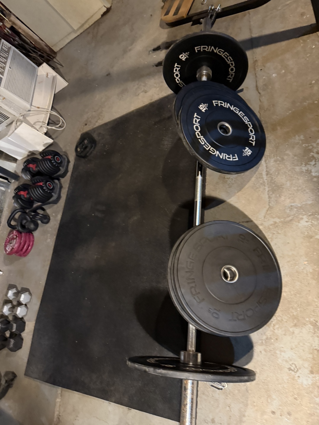 Olympic barbell with three sets of bumper plates