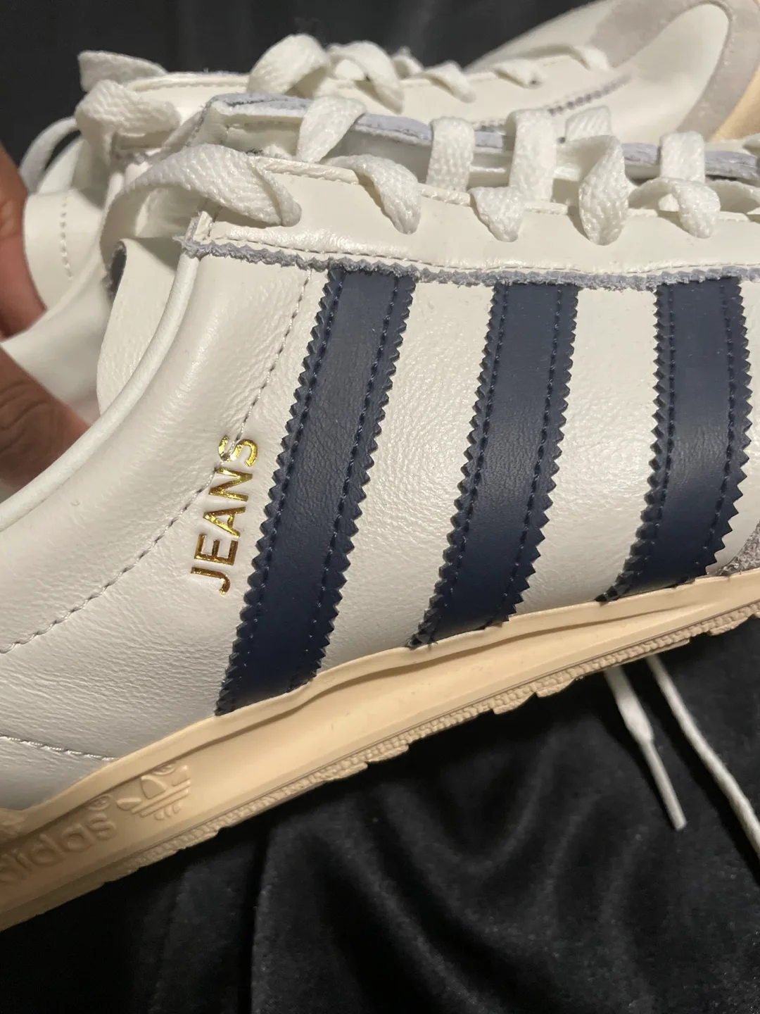 Navy blue and white adidas shoes image indicator(2)