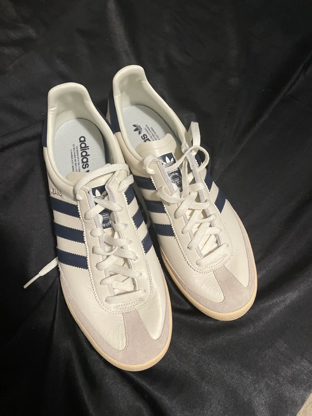 Navy blue and white adidas shoes image indicator(4)