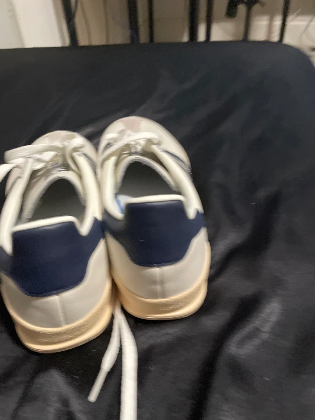 Navy blue and white adidas shoes image indicator(3)