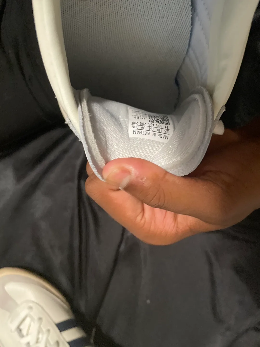 Navy blue and white adidas shoes image indicator(5)