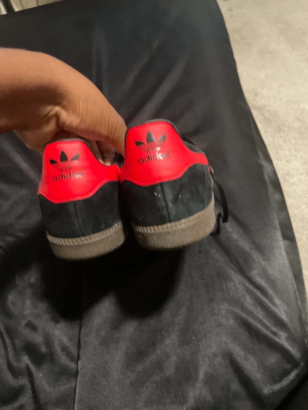 Red and black adidas shoes image indicator(3)