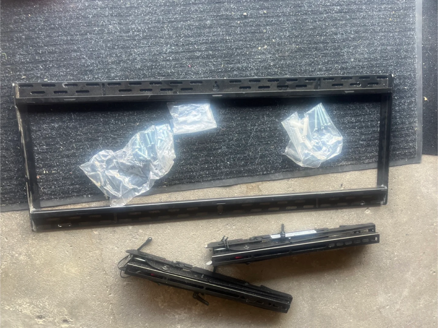 Black Metal tv mount with Hardware image indicator(2)