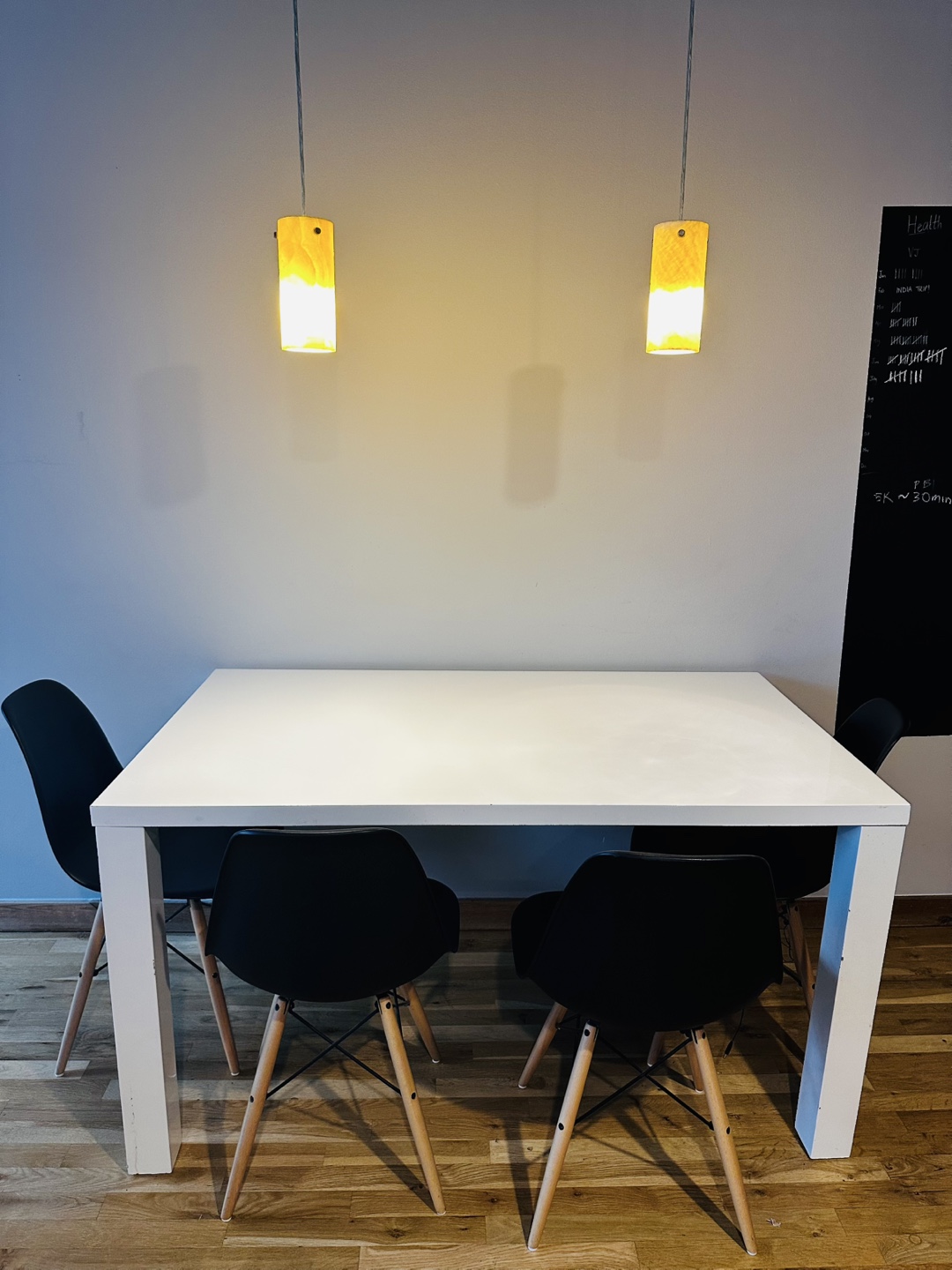 White Dining Table with 4 Black Chairs
