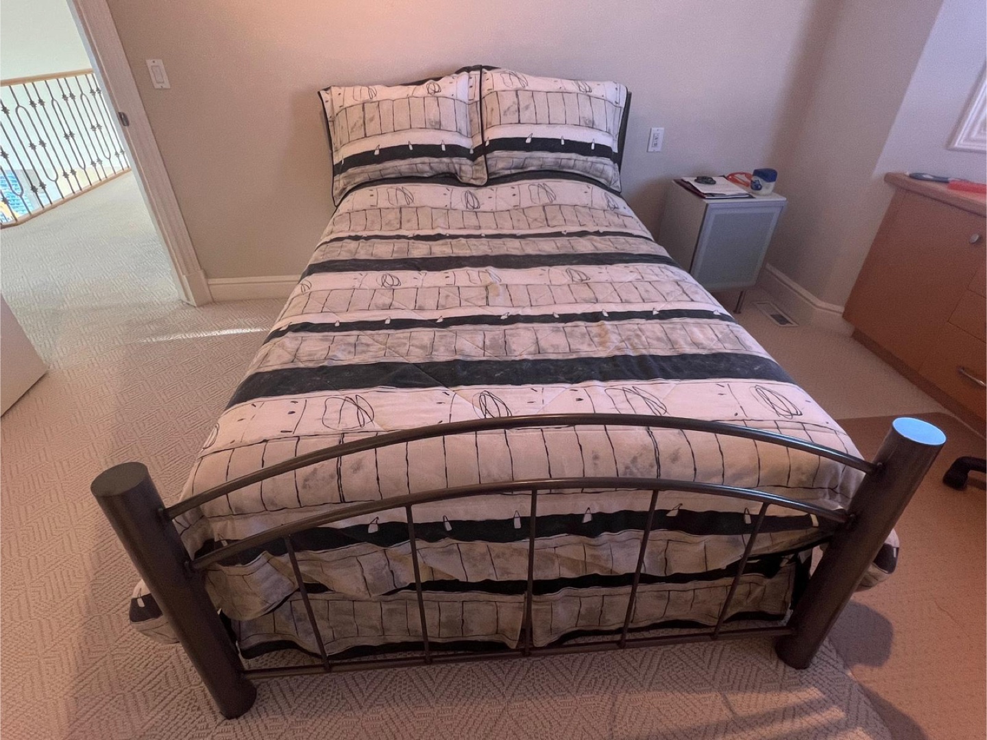 Double Size metal bed frame with mattress and box spring.