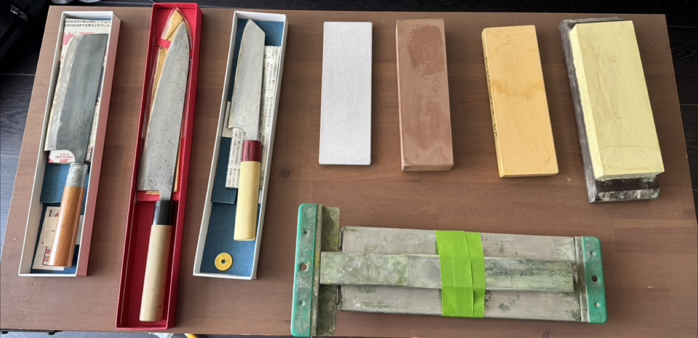 Japanese kitchen knives, stones and sink bridge