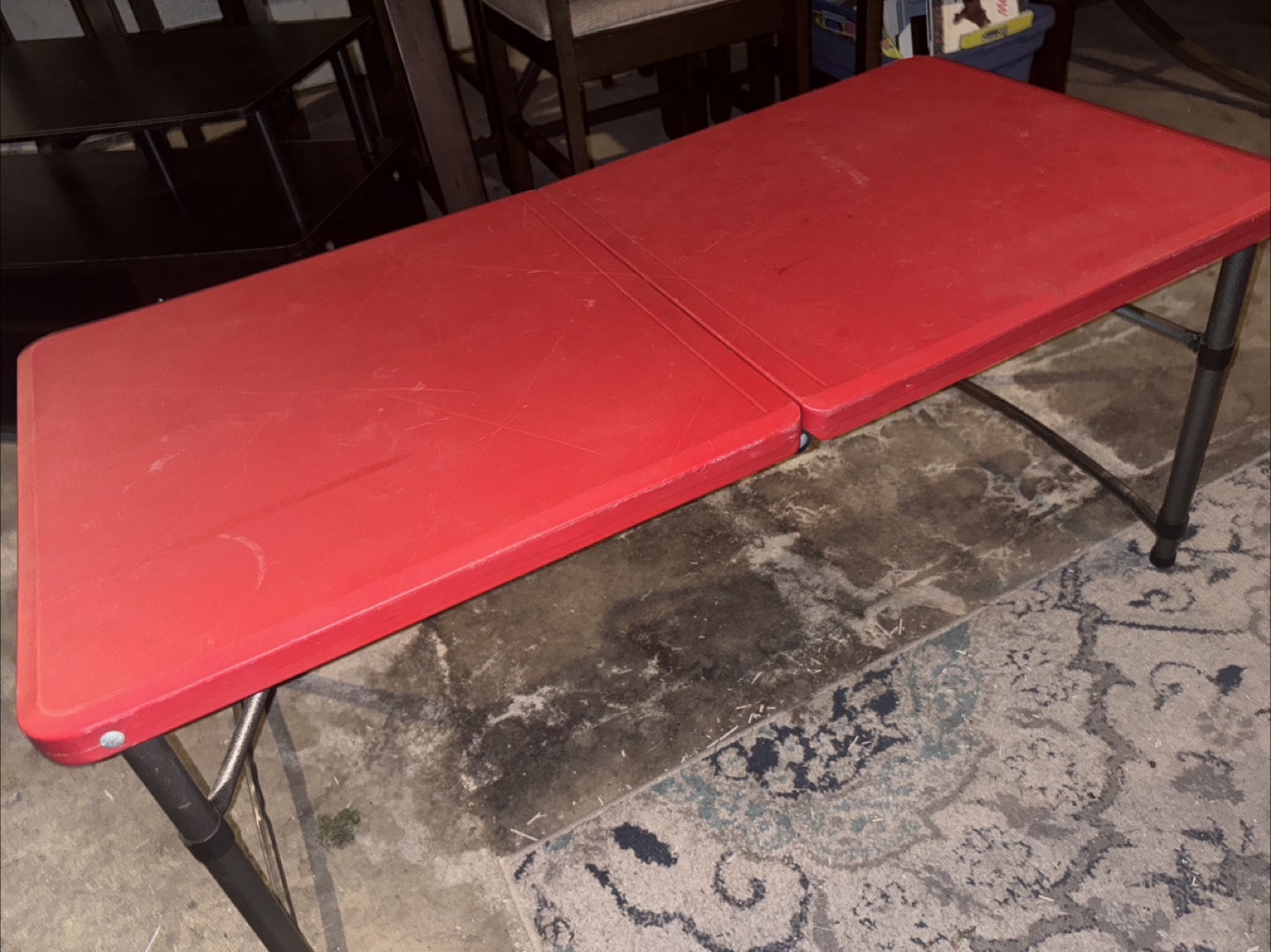 Red kids table . Adjustable legs to make higher