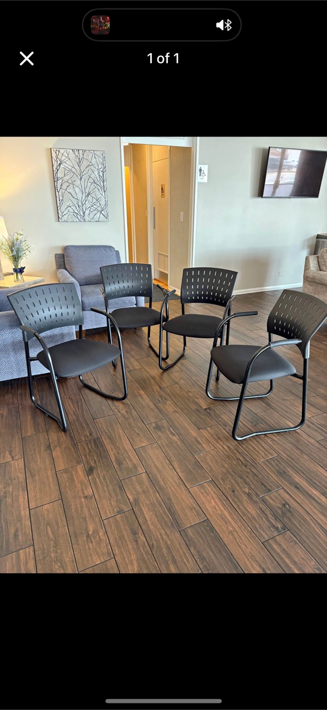 4 black office chairs. Made by zoom