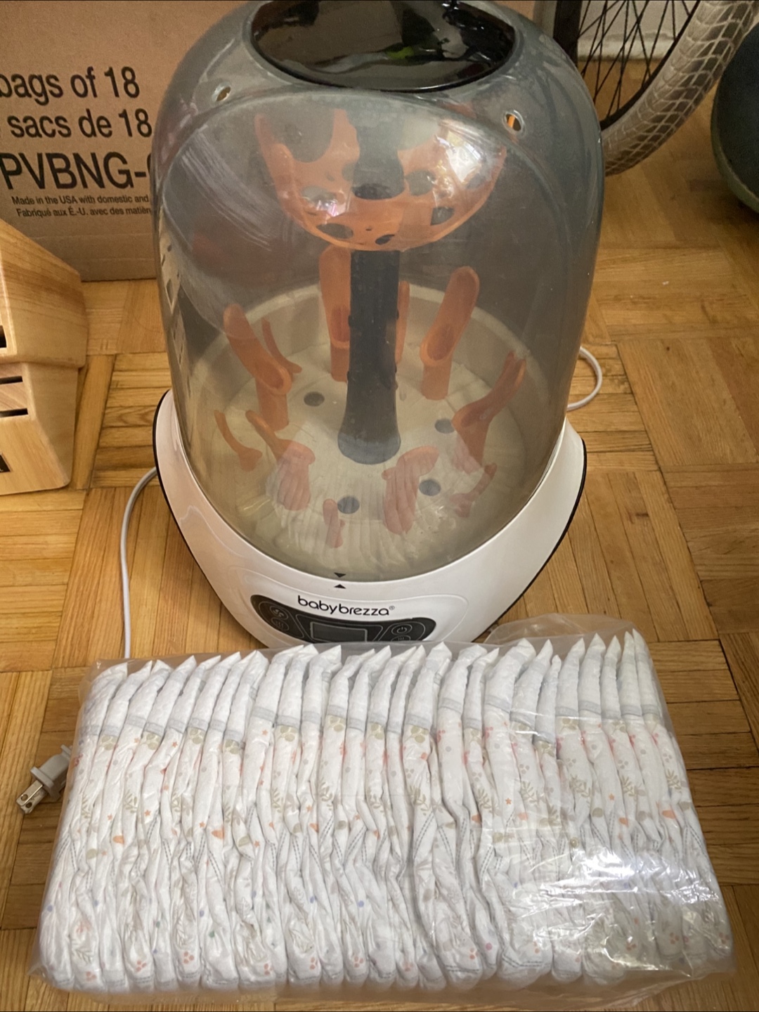 Moving out sale Baby breeza bottle sterilizer with diaper 26pcs