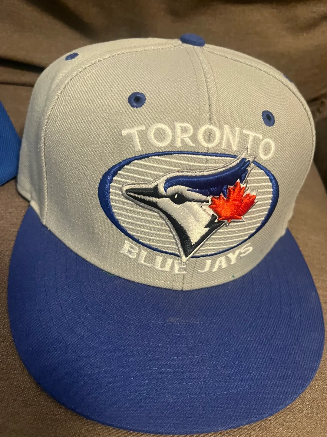 Blue jays and Dodgers hats image indicator(3)