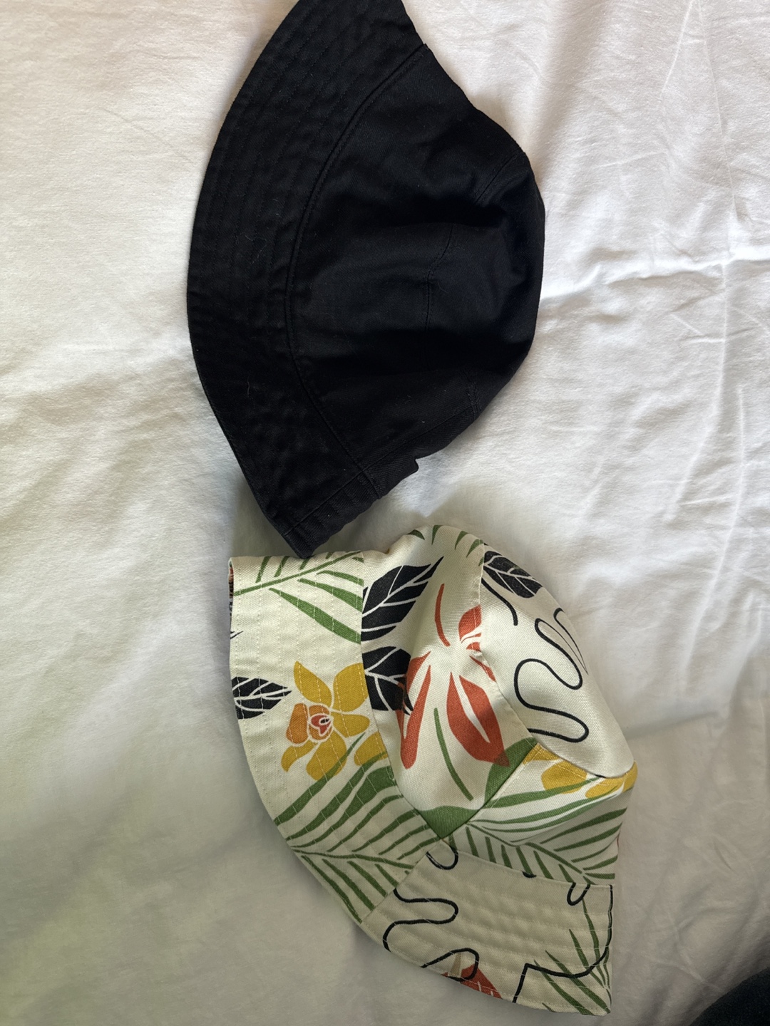 Two bucket hats: Black & Floral